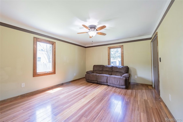 21128 Middlebelt Rd, New Boston, MI 48164 - living area with a ceiling fan and light wood-style flooring