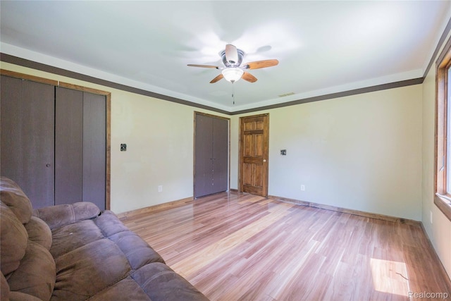 21128 Middlebelt Rd, New Boston, MI 48164 - living area featuring a ceiling fan and light wood-style floors
