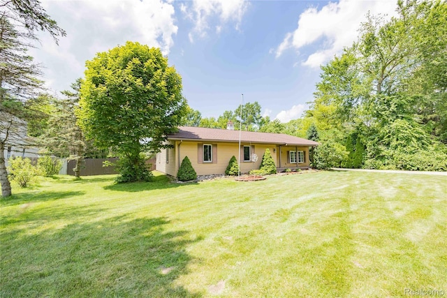 21128 Middlebelt Rd, New Boston, MI 48164 - rear view of property featuring a chimney