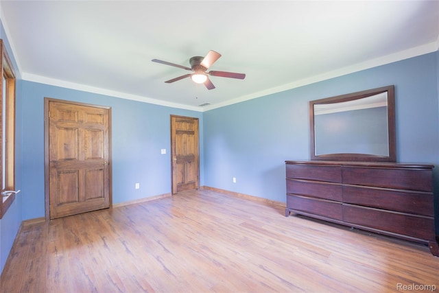 21128 Middlebelt Rd, New Boston, MI 48164 - unfurnished bedroom featuring wood finished floors, a ceiling fan, and ornamental molding