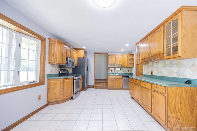 21128 Middlebelt Rd, New Boston, MI 48164 - kitchen with appliances with stainless steel finishes, backsplash, open shelves, glass insert cabinets, and recessed lighting