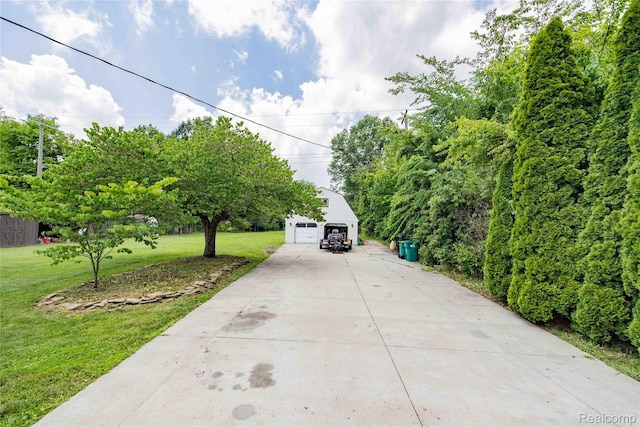 21128 Middlebelt Rd, New Boston, MI 48164 - view of front of house with a front lawn, an outbuilding, and a detached garage