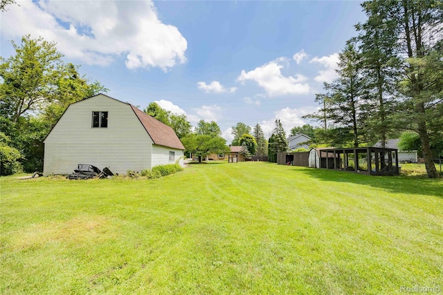 21128 Middlebelt Rd, New Boston, MI 48164 - view of green lawn featuring an outdoor structure