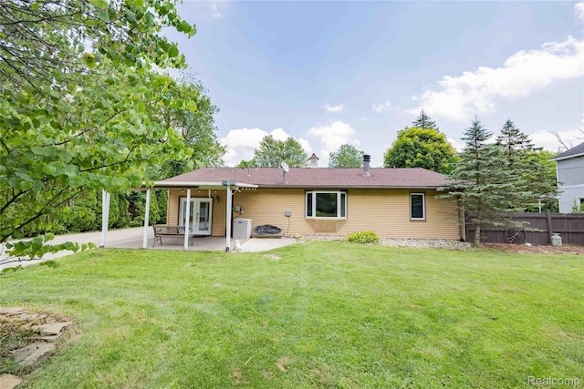21128 Middlebelt Rd, New Boston, MI 48164 - rear view of property featuring a patio and french doors