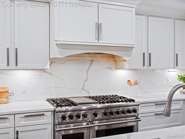 295 S Cranbrook Rd, Birmingham, MI 48009 - kitchen with range with two ovens, custom range hood, white cabinetry, and decorative backsplash