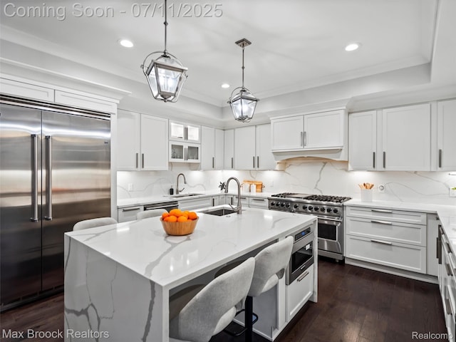 295 S Cranbrook Rd, Birmingham, MI 48009 - kitchen with built in appliances, recessed lighting, white cabinets, light stone countertops, and crown molding
