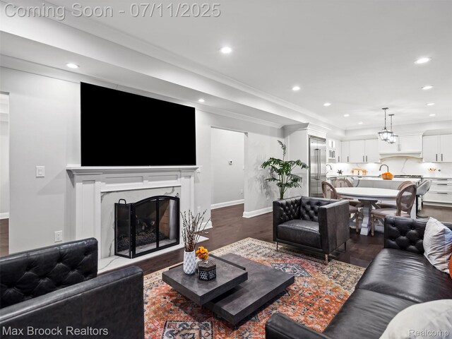 295 S Cranbrook Rd, Birmingham, MI 48009 - living area featuring recessed lighting, a premium fireplace, dark wood-style floors, and crown molding