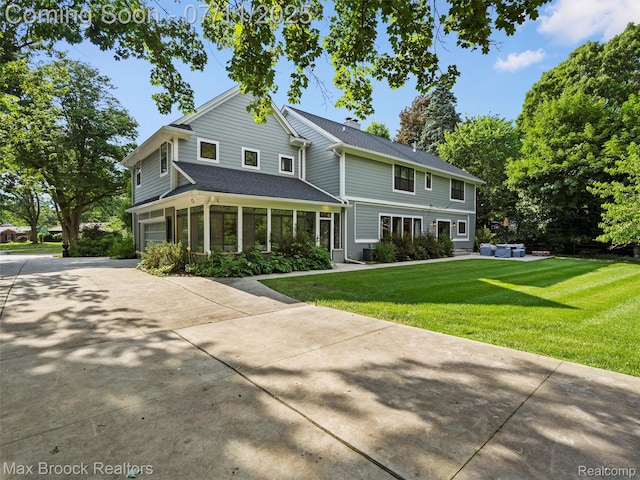 295 S Cranbrook Rd, Birmingham, MI 48009 - view of front of property with an attached garage, a front lawn, concrete driveway, and a shingled roof