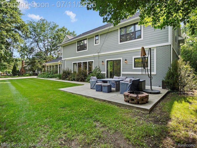 295 S Cranbrook Rd, Birmingham, MI 48009 - rear view of house with a patio, a yard, brick siding, and an outdoor living space with a fire pit