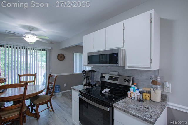 50191 N Angelo Ct, Chesterfield, MI 48047 - kitchen with appliances with stainless steel finishes, backsplash, light wood-style flooring, white cabinetry, and a ceiling fan