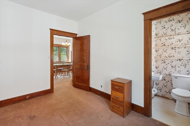 418 Main St, Battle Creek, MI 49014 - empty room with light carpet and a chandelier