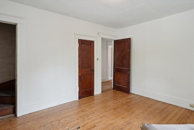 418 Main St, Battle Creek, MI 49014 - unfurnished room with light wood finished floors and baseboards