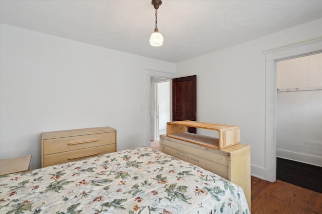 418 Main St, Battle Creek, MI 49014 - bedroom featuring wood finished floors, a walk in closet, and a closet