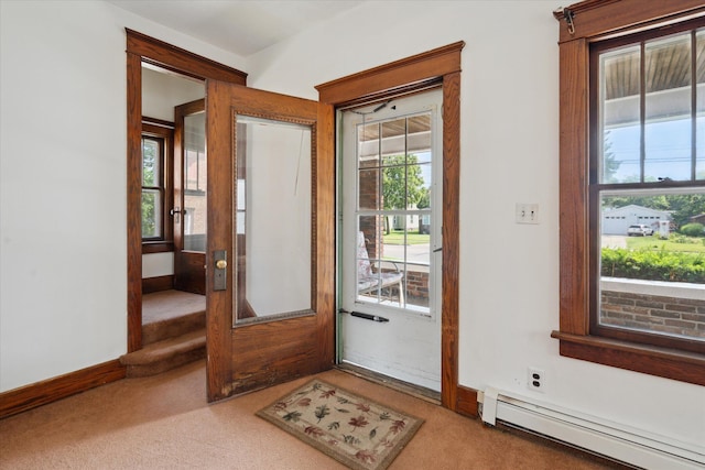 418 Main St, Battle Creek, MI 49014 - doorway to outside with a baseboard radiator and light carpet