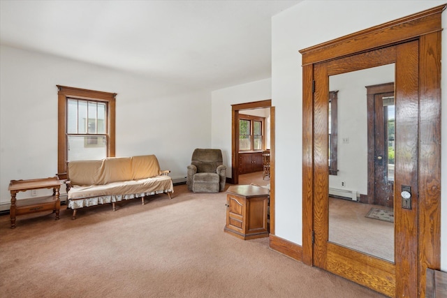 418 Main St, Battle Creek, MI 49014 - sitting room featuring a baseboard heating unit and light colored carpet
