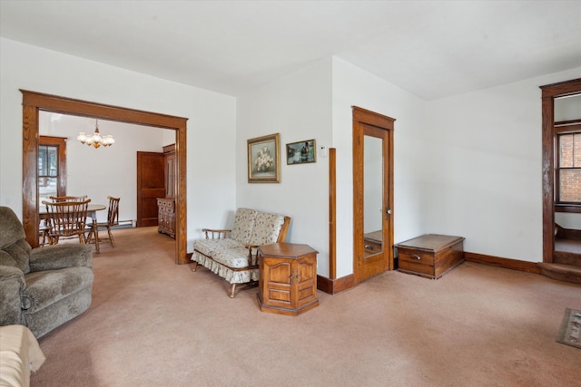 418 Main St, Battle Creek, MI 49014 - living area with light colored carpet, a chandelier, and french doors
