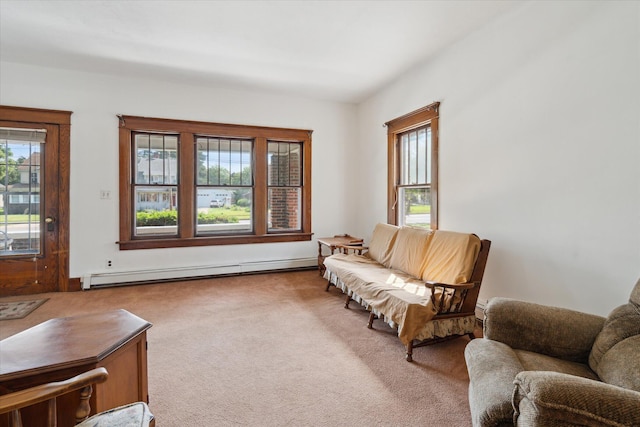 418 Main St, Battle Creek, MI 49014 - living area with a baseboard heating unit, healthy amount of natural light, and carpet