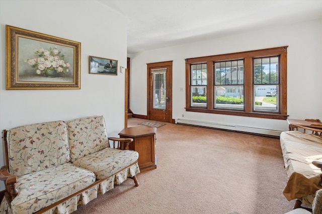 418 Main St, Battle Creek, MI 49014 - living area featuring baseboard heating and light colored carpet