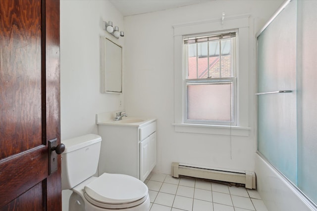 418 Main St, Battle Creek, MI 49014 - bathroom featuring a baseboard heating unit, vanity, tile patterned flooring, and combined bath / shower with glass door