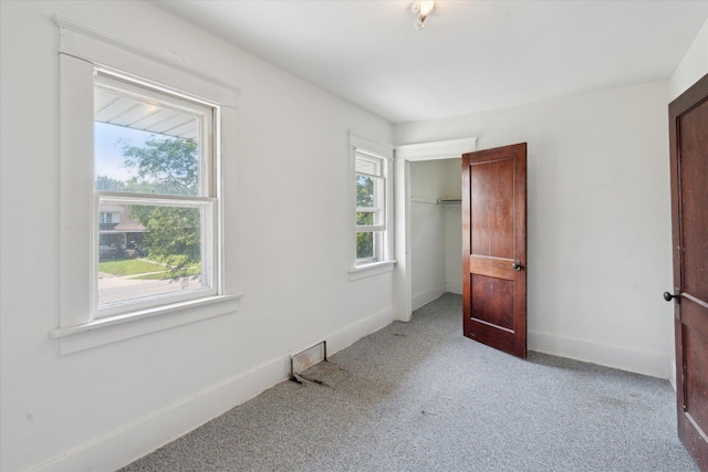 418 Main St, Battle Creek, MI 49014 - unfurnished bedroom featuring carpet and a closet
