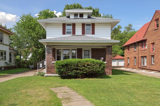 418 Main St, Battle Creek, MI 49014 - traditional style home featuring a porch, a front yard, roof with shingles, and brick siding