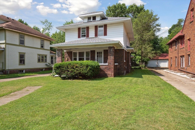 418 Main St, Battle Creek, MI 49014 - traditional style home with brick siding, a front yard, an outdoor structure, and a detached garage