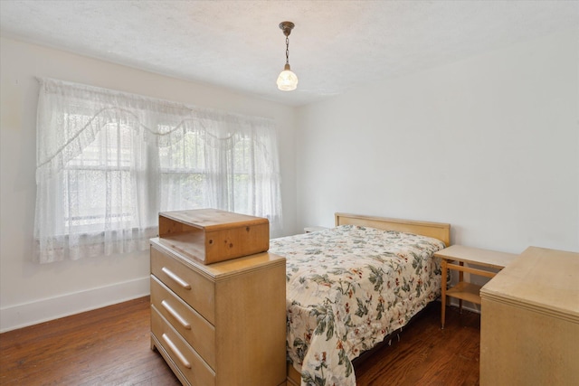 418 Main St, Battle Creek, MI 49014 - bedroom with dark wood finished floors and baseboards