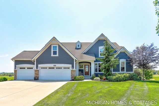 4401 Grand Pt, Holland, MI 49424 - craftsman inspired home featuring a front yard, driveway, and an attached garage