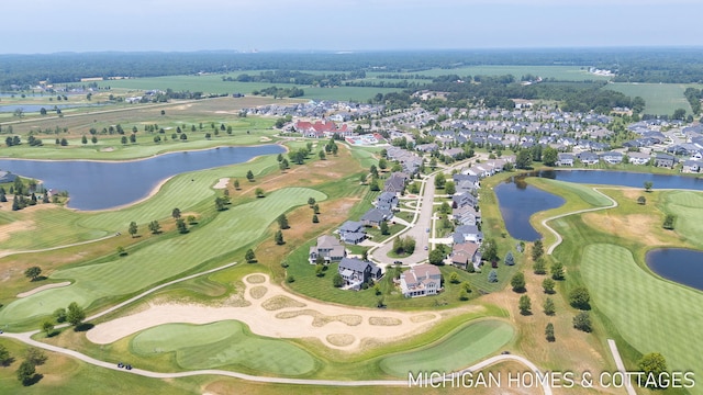 4401 Grand Pt, Holland, MI 49424 - aerial view of property and surrounding area with a nearby body of water and nearby suburban area