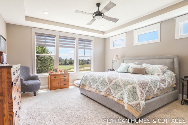 4401 Grand Pt, Holland, MI 49424 - bedroom featuring carpet floors, ceiling fan, a tray ceiling, and recessed lighting