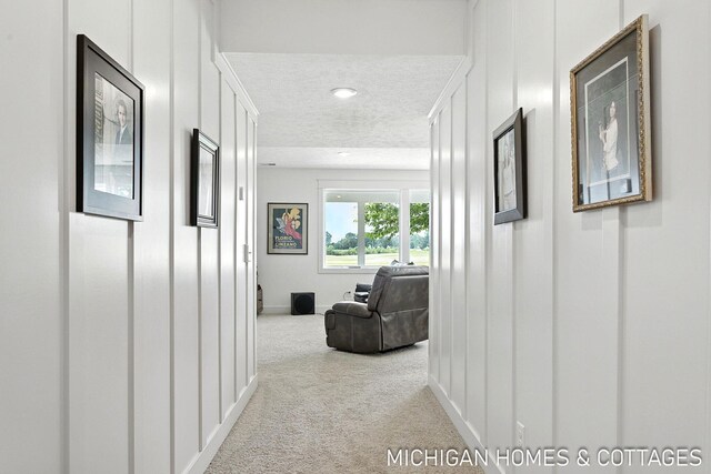4401 Grand Pt, Holland, MI 49424 - corridor featuring carpet floors, a textured ceiling, and recessed lighting