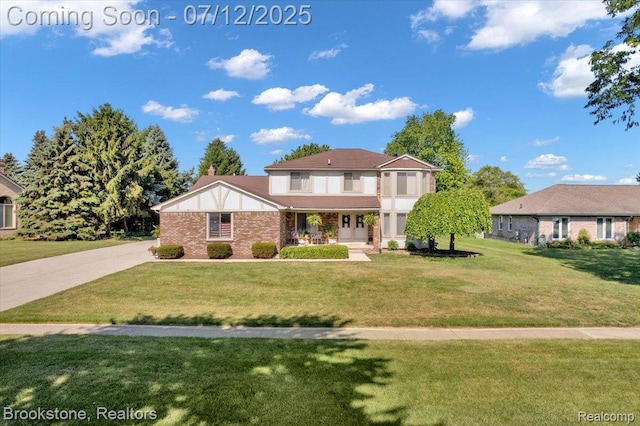 46655 Spruce Dr, Shelby Twp, MI 48315 - view of front of property featuring a front lawn and brick siding