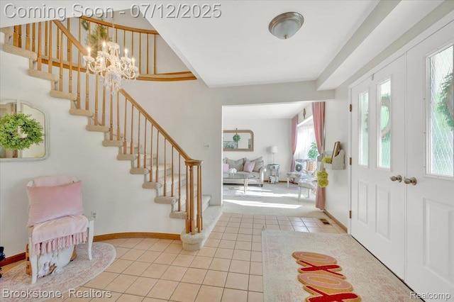 46655 Spruce Dr, Shelby Twp, MI 48315 - entrance foyer featuring stairs, tile patterned flooring, and a chandelier