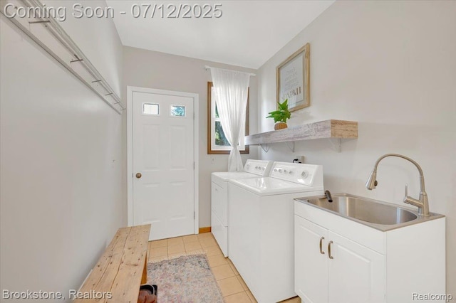 46655 Spruce Dr, Shelby Twp, MI 48315 - laundry room with washing machine and clothes dryer and light tile patterned floors