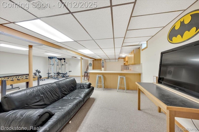 46655 Spruce Dr, Shelby Twp, MI 48315 - living room featuring bar with sink, light carpet, and a drop ceiling
