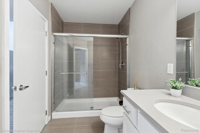 293 N 2nd St Unit 106, Brighton, MI 48116 - bathroom with vanity, a shower stall, and tile patterned floors