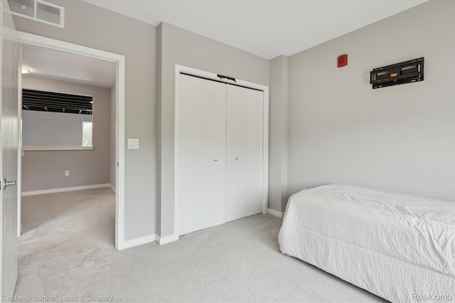 293 N 2nd St Unit 106, Brighton, MI 48116 - carpeted bedroom with baseboards and a closet