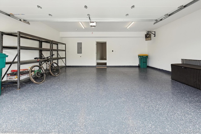 293 N 2nd St Unit 106, Brighton, MI 48116 - garage with electric panel and a garage door opener