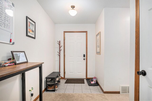 15303 Arborwood Dr, Grand Haven, MI 49417 - foyer entrance with baseboards and light tile patterned floors