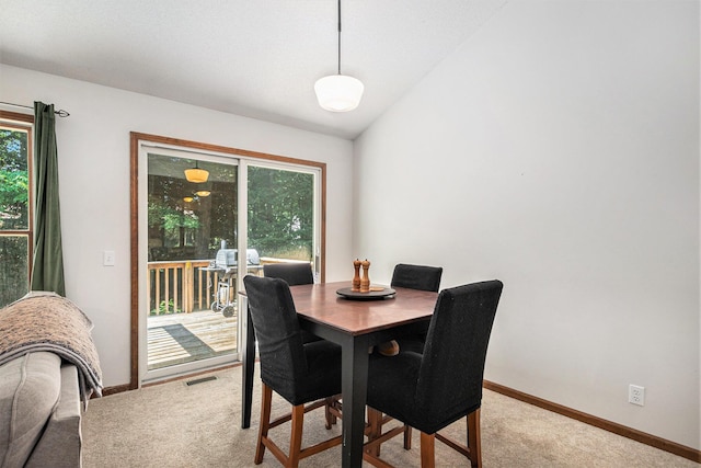 15303 Arborwood Dr, Grand Haven, MI 49417 - dining space featuring light colored carpet and baseboards