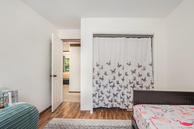 15303 Arborwood Dr, Grand Haven, MI 49417 - bedroom with wood finished floors and baseboards