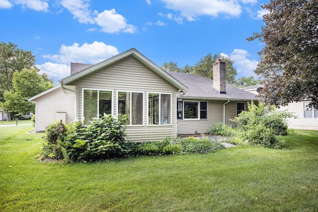 9477 Lightwood Ct, Richland, MI 49083 - back of property with a lawn, a chimney, and roof with shingles