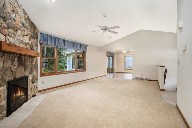 9477 Lightwood Ct, Richland, MI 49083 - unfurnished living room featuring light colored carpet, a ceiling fan, lofted ceiling, and a fireplace