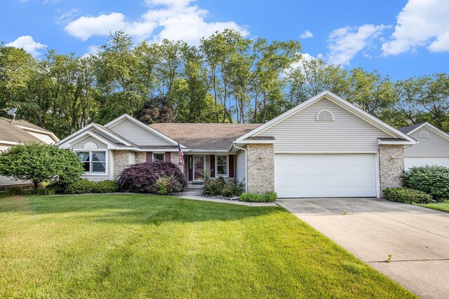 9477 Lightwood Ct, Richland, MI 49083 - ranch-style home featuring an attached garage, brick siding, driveway, and a front yard