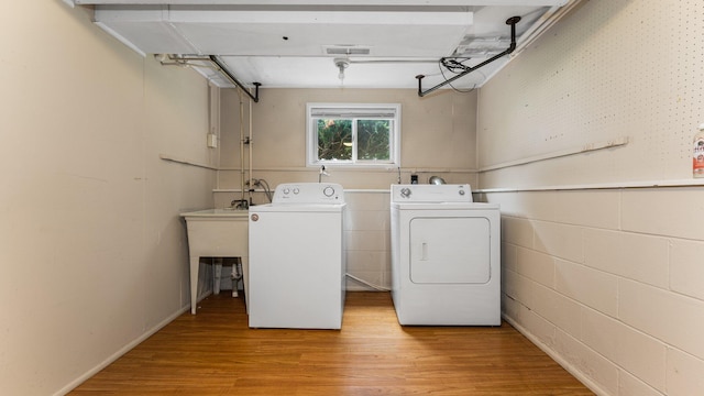 2204 Walter Dr, Ann Arbor, MI 48103 - laundry area with washer and dryer and light wood-style floors