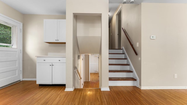 2204 Walter Dr, Ann Arbor, MI 48103 - stairs featuring wood finished floors