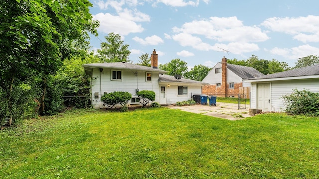 2204 Walter Dr, Ann Arbor, MI 48103 - back of house with a patio and a chimney