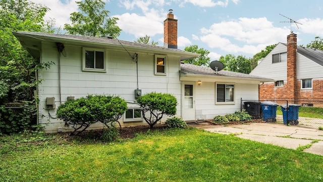 2204 Walter Dr, Ann Arbor, MI 48103 - rear view of house featuring a chimney