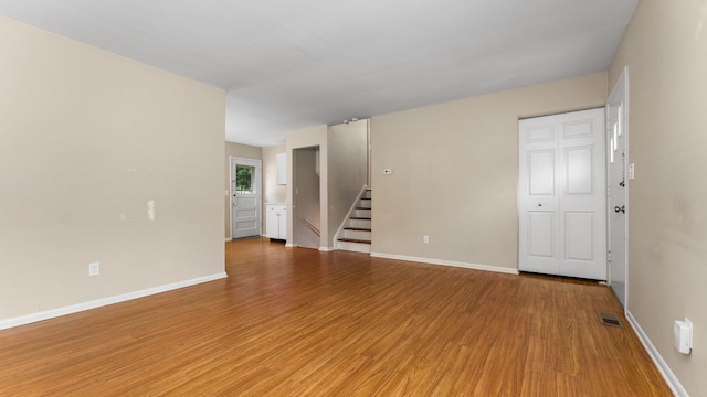 2204 Walter Dr, Ann Arbor, MI 48103 - spare room with light wood finished floors and stairway