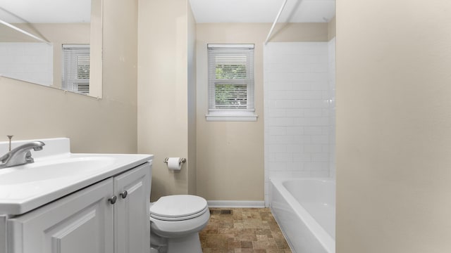 2204 Walter Dr, Ann Arbor, MI 48103 - bathroom featuring vanity, stone finish flooring, and shower / washtub combination